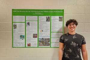  Joe standing in front of his research poster