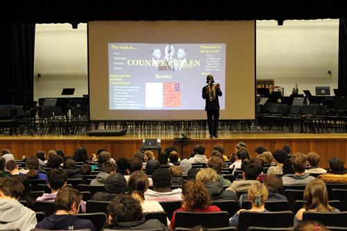 Teacher Albert Cook presenting to students