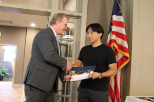 Principal Award nominee Darren Chen receiving certificate